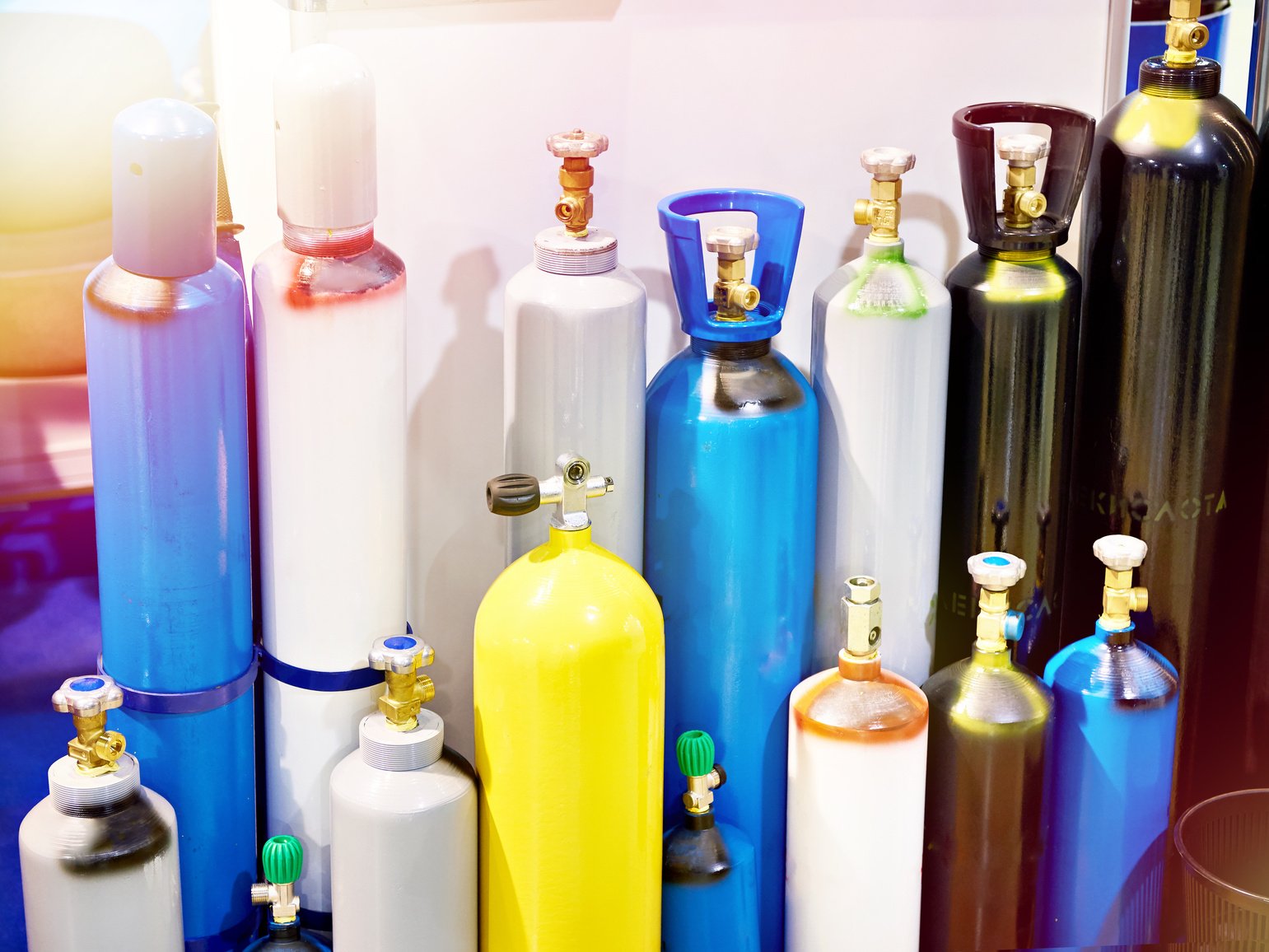 Metal cylinders for compressed gases